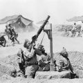 INDIAN FORCES IN MESOPOTAMIA, 1918 (Q 24781) Jat Lewis gunner firing at enemy plane while the other Sepoys rush to funk pits for safety, Copyright: © IWM. Original Source: http://www.iwm.org.uk/collections/item/object/205194943